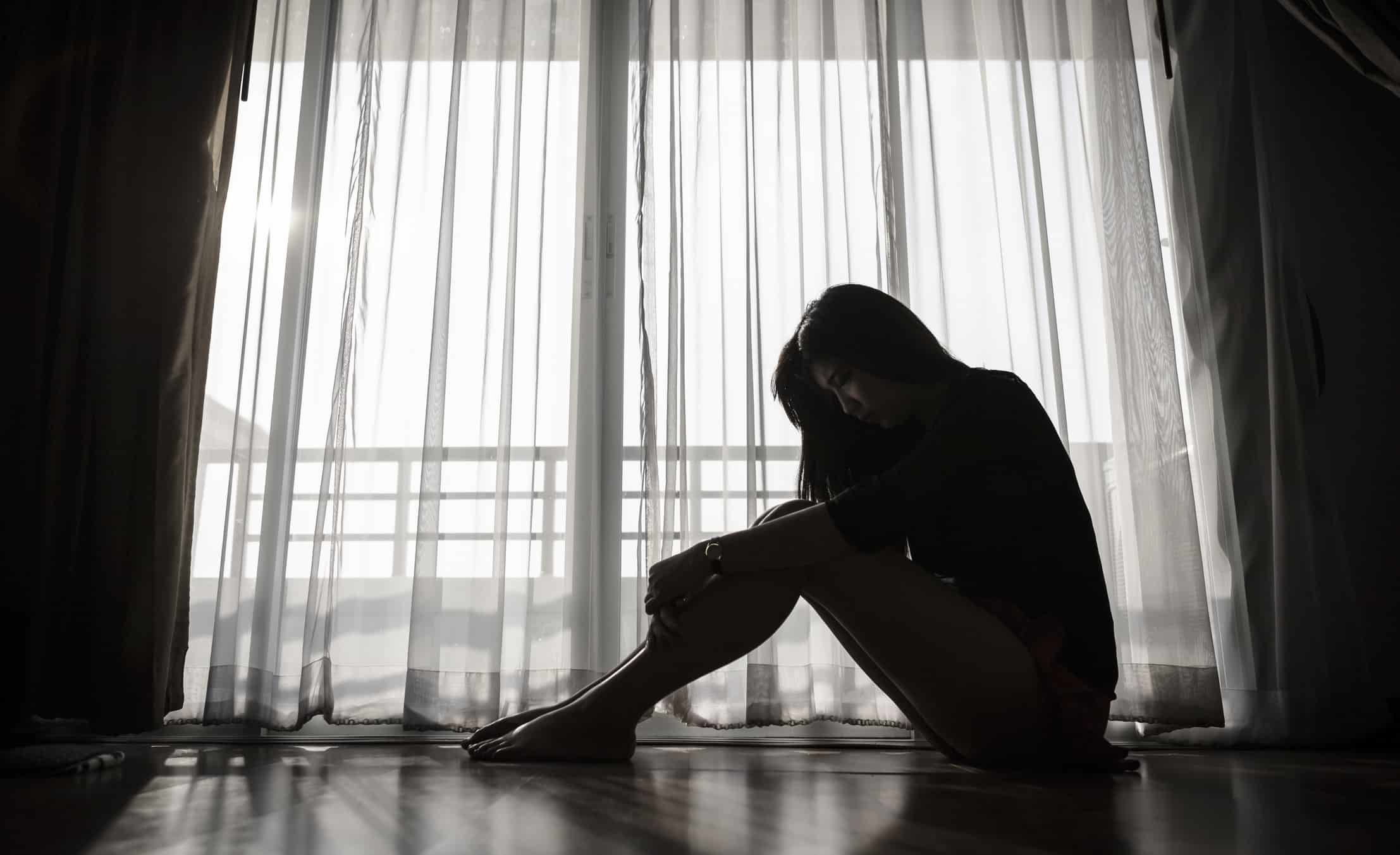 sad woman sitting alone