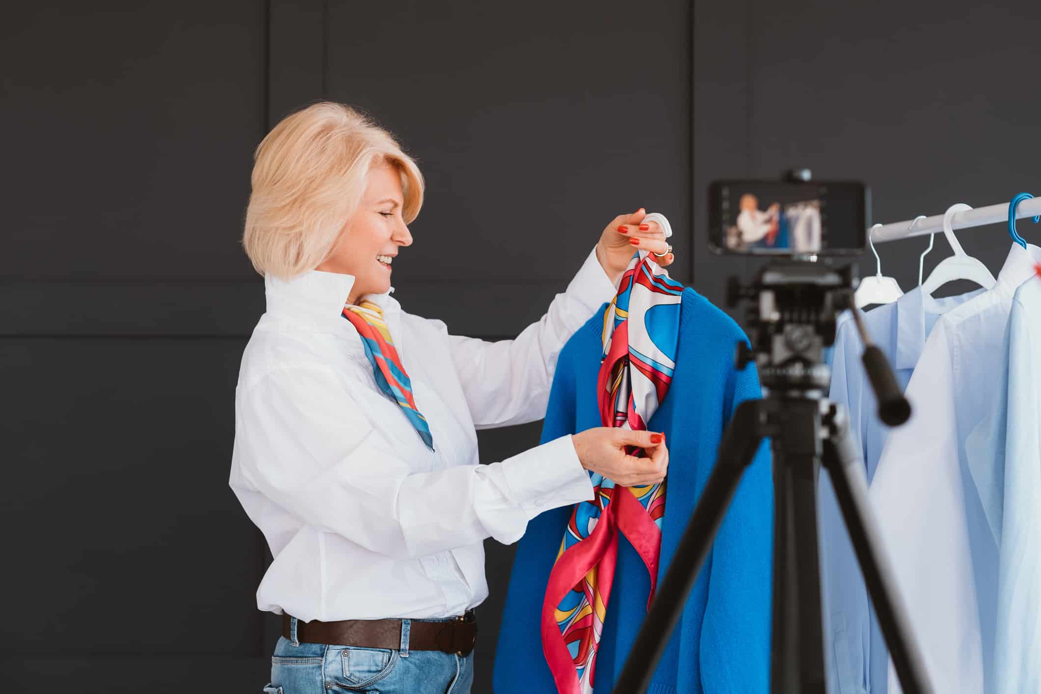 Senior lady vlogger. Fashion stylist at work. Aged influencer making video tutorial on personal style. Business and hobby.