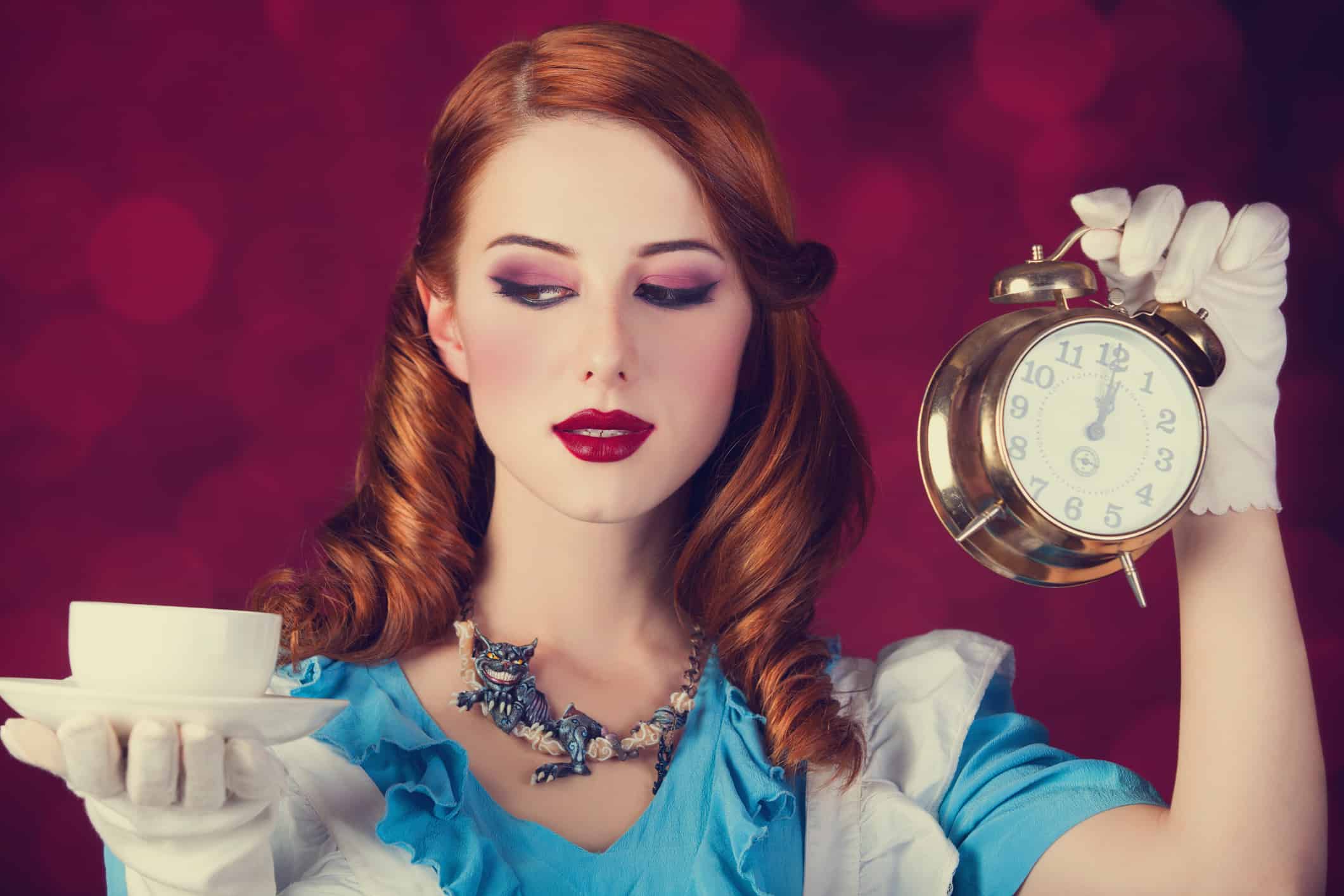 Portrait of a young redhead woman dressed as Alice in Wonderland, video game.