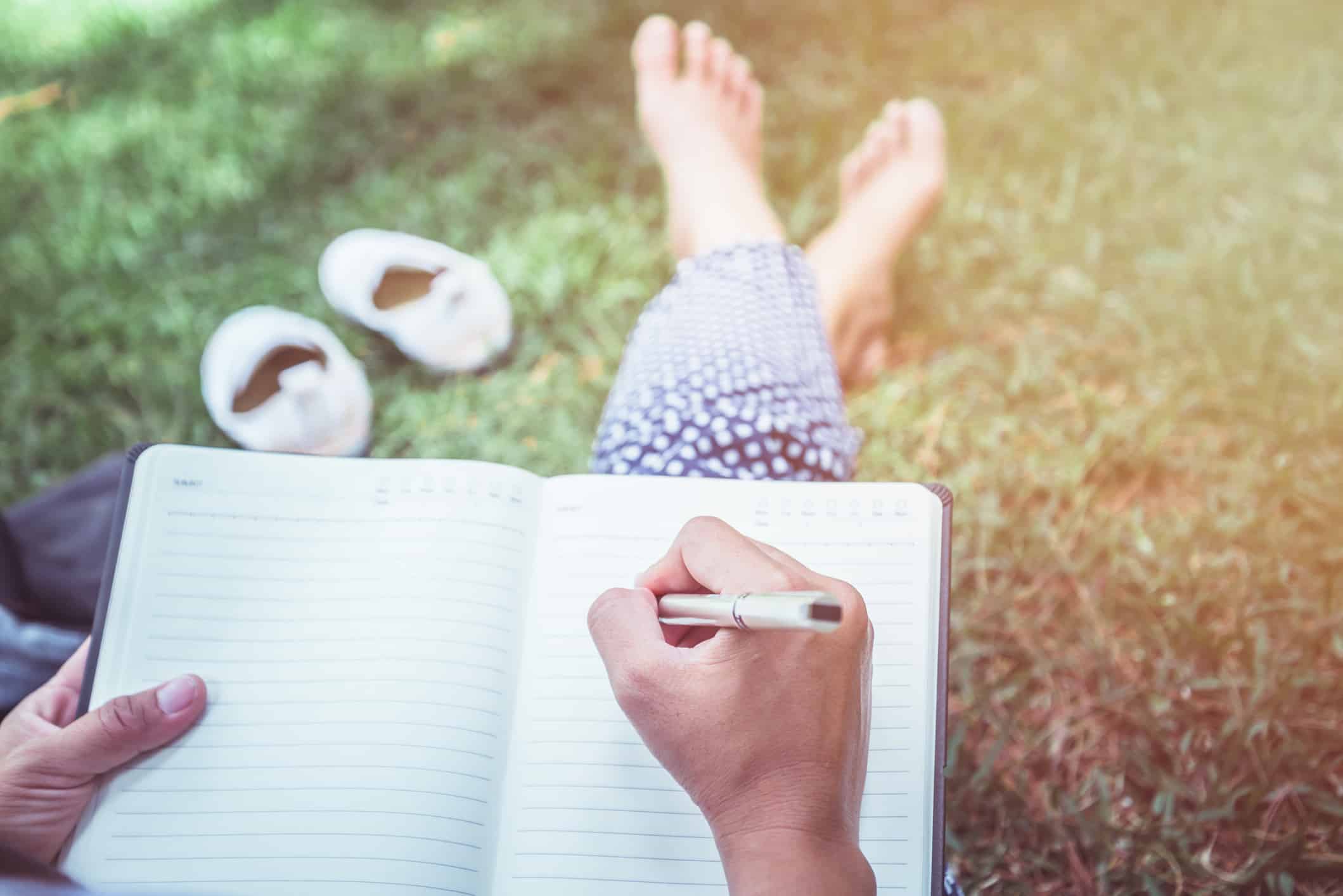 Women write notes Nature trails, mountains, forests. Writer