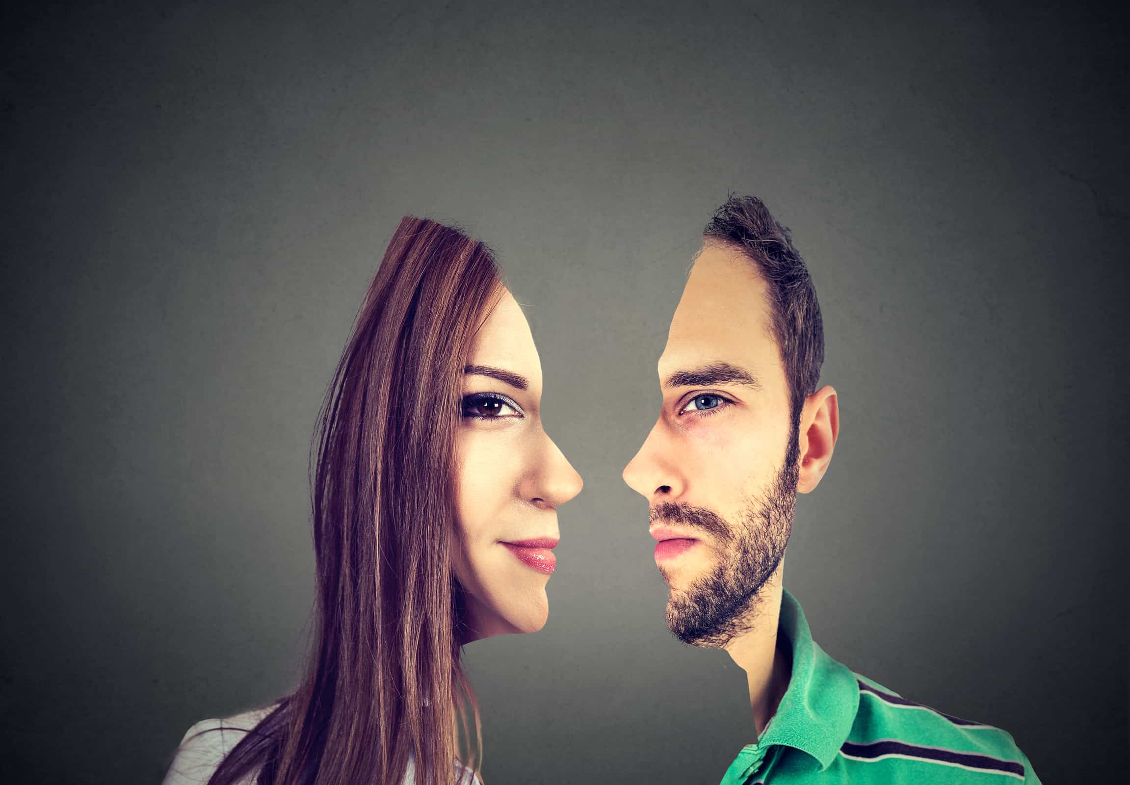 surrealistic portrait front with cut out profile of a young man and woman isolated on grey wall background