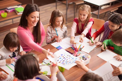 Men dressed as woman teaching kids