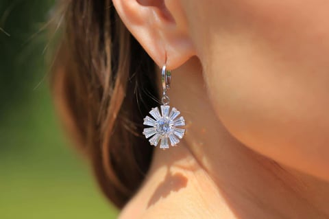 Crossdressing with silver earrings