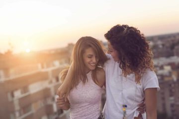 Crossdresser with her hand around her wife or girlfriend
